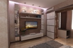Интерьер трехкомнатной квартиры. Дизайн спальни с гардеробной и утеплённой лоджией